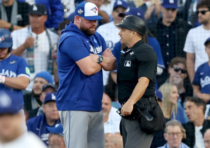LOS ANGELES – Mark Wegner was slow to the draw. And the homeplate umpire cost the Toronto Blue Jays at least one run with his deliberate actions in the second inning of World Series Game 3. 
With Bo Bichette on first base and a 3-1 count on Daulton Varsho, Los Angeles Dodgers starter Tyler Glasnow threw a pitch above strike zone. Pitch tracking indicated it was ball four. 
And Wegner, the homeplate umpire, indicated it was ball four – by doing nothing. 
Varsho paused, heard no strike call and took two tentative steps toward first. Bichette wandered toward second base to advance. 
And then Wegner casually initiated his called-strike mechanism. The count was full – but Bichette was about 30 feet off the bag by then. 
And Glasnow tossed the ball to first baseman Freddie Freeman, who tagged Bichette for a huge first out of the inning. 
How huge? Well, Varsho did eventually walk. Alejandro Kirk followed with a single to right field that Bichette certainly would’ve scored on. 
It theoretically could’ve been 1-0 Toronto, with runners on first and second and nobody out. 
Instead, Bichette was erased, Addison Barger struck out and Ernie Clement lined out to center. 
Inning over. No runs for the Blue Jays. And manager John Schneider helpless, save to continue the conversation with Wegner, also the crew chief, between innings. 
This post appeared first on USA TODAY Umpire’s hesitation costs Blue Jays in World Series gaffe